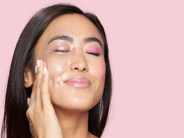 woman added water to face to further emulsify the cleansing balm