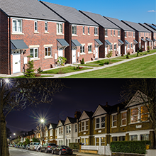 a row of houses at night