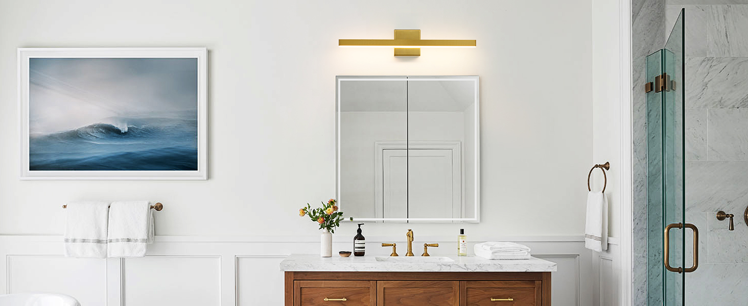 brushed gold bathroom light fixtures above mirror