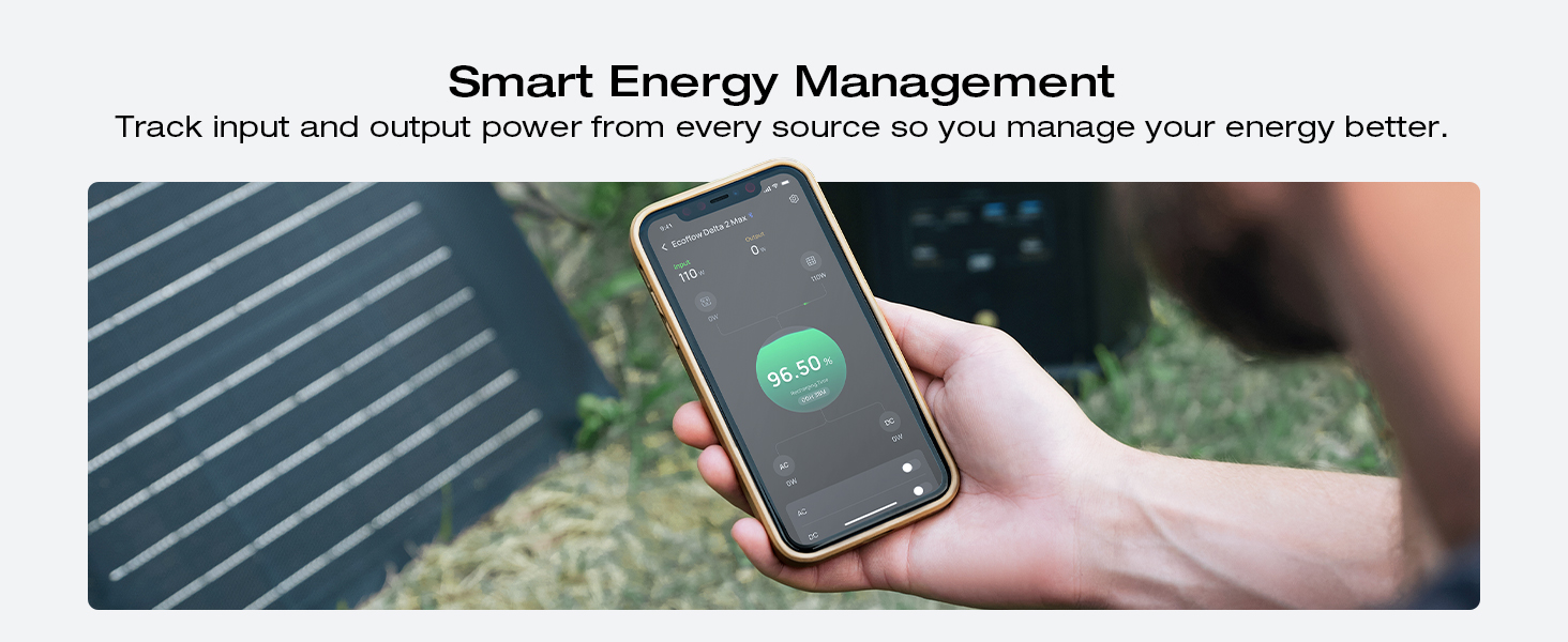 Smartphone displaying energy management app with circular green icon. Hand holding phone against blurred outdoor background with text about smart energy tracking.