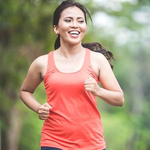 Young healthy Asian woman jogging in the park