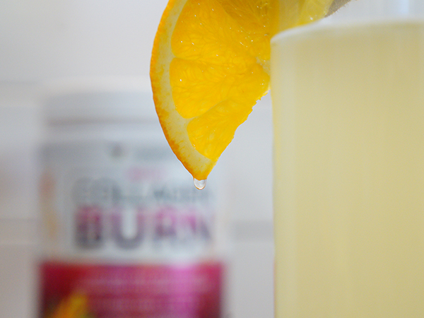 Orange slice with a drop of Multi Collagen Burn mixed in with liquid