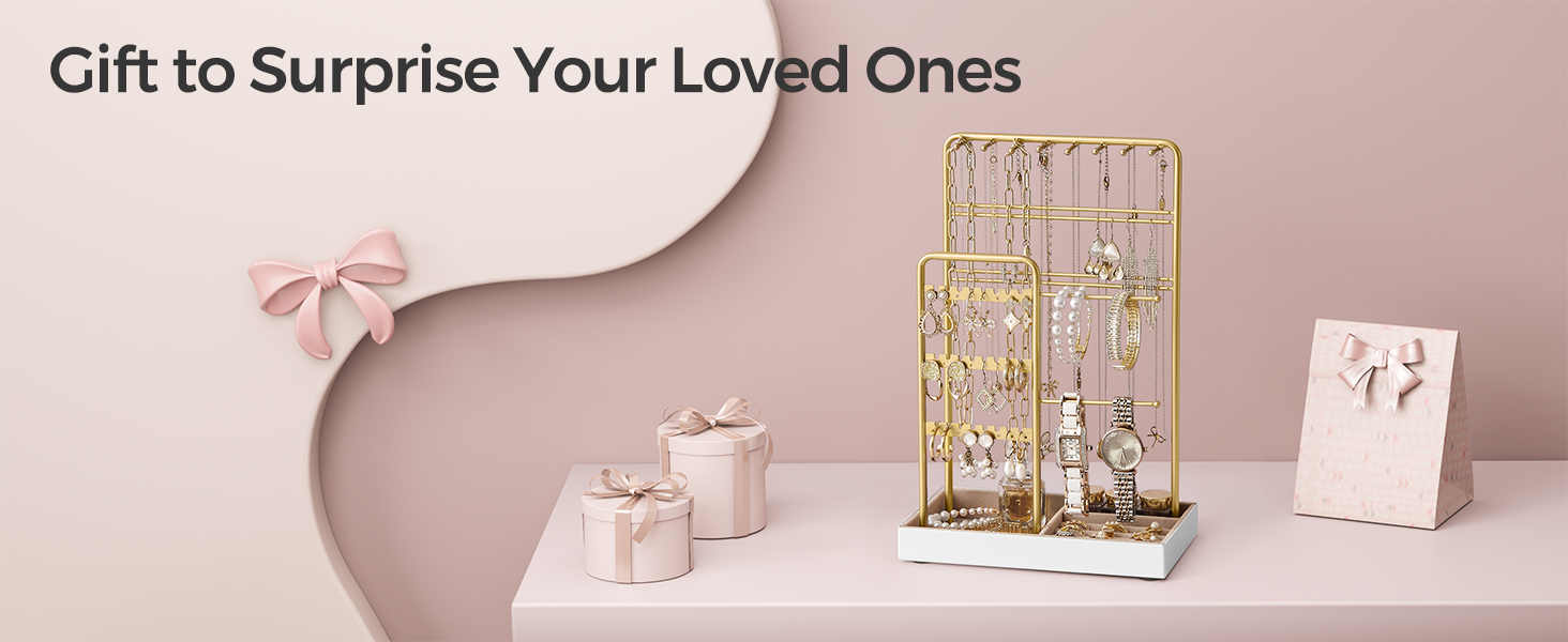Gift display setup with gold decorative grid structure and small pink wrapped presents on a pink surface with curved decorative element.