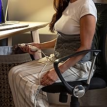 Close-up shots demonstrating ergonomic office chair features, showing armrest adjustments and seating positions.