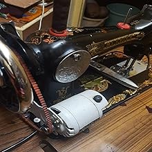 Nylon motor belts being used with an old cast iron sewing machine, showcasing compatibility.