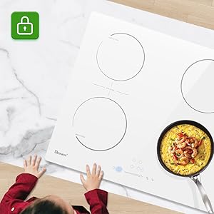 Overhead view of a white surface with circular outlines. Small hands visible at bottom. Green padlock icon in top left. Yellow pan with food in bottom right.