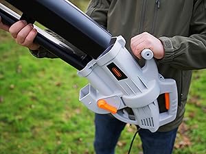 Outdoor action shots of hands operating a grey and orange power tool against grass background, showing different grip positions.