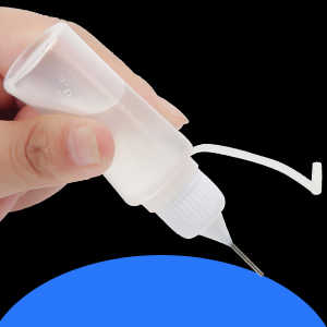 empty plastic bottle with metal needle