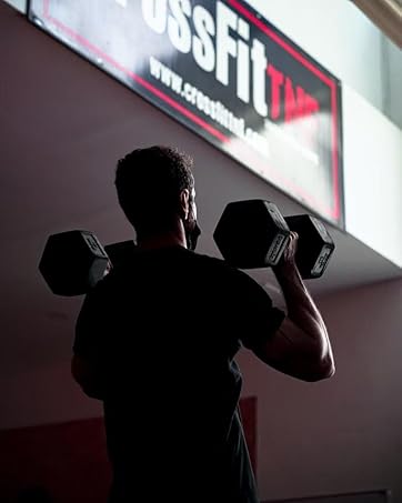 a man lifting weights in a gym