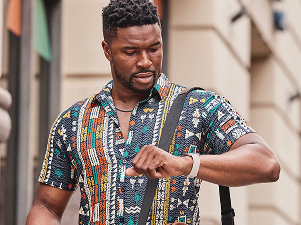 Model wearing Fitbit Sense 2 smartwatch 