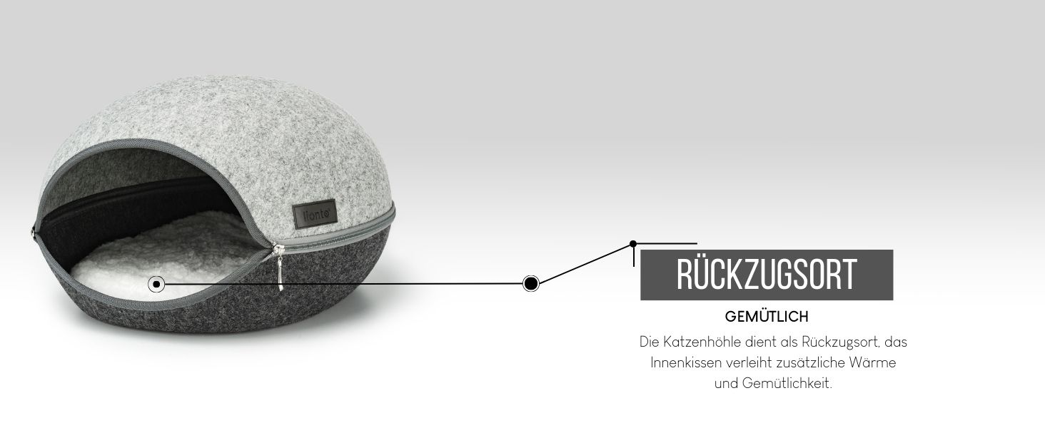 Kuppelförmiges Haustierbett aus hellgrauem Filzmaterial. Es verfügt über einen runden Eingang und ein Etikett mit der Aufschrift „Ruckzugsort“, speziell für kleine Haustiere