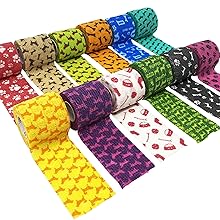 Multiple rolls of colorful patterned adhesive tape. Designs include paw prints, bones, and other animal-themed patterns in various colors.