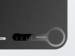 una foto de un dispositivo electrónico negro con un botón azul.