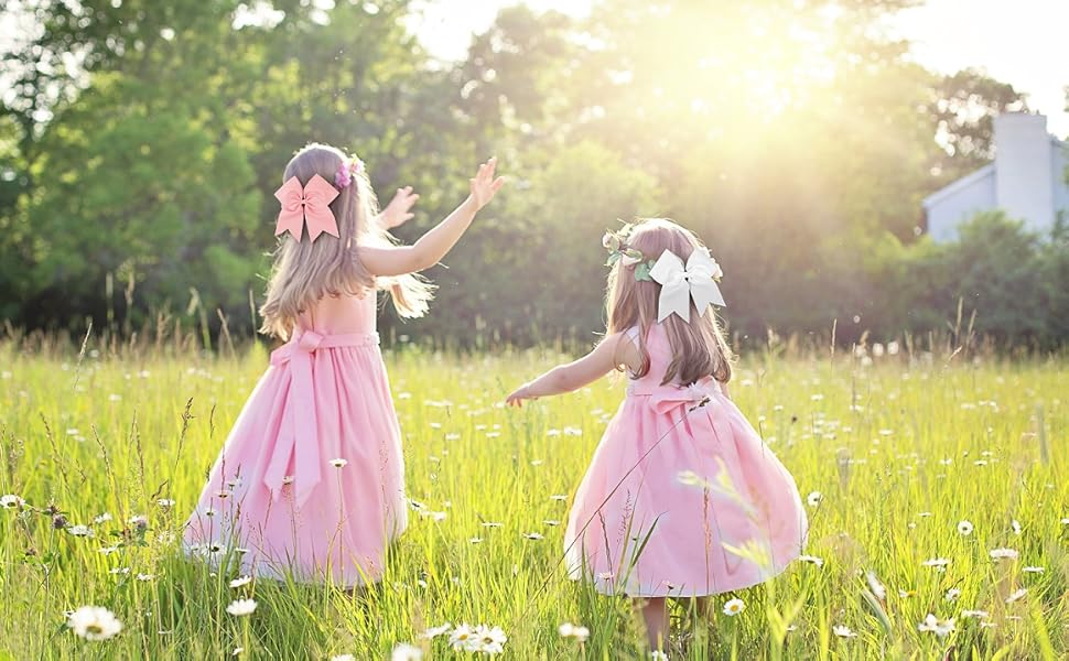 two girl pink bow and white bow