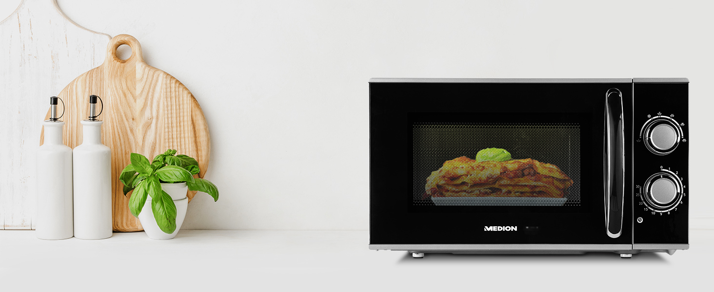 un forno a microonde con dentro un piatto.