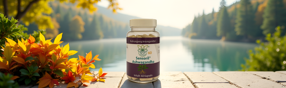 Glasglasprodukt, fotografiert auf Holzoberfläche mit Herbstblumen und Seenlandschaft im Hintergrund.
