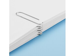 closeup of paperclips holding several papers together on blue background