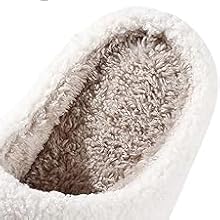 Closeup of white textured slippers showing plush, fuzzy interior lining. Multiple angles displayed of cozy indoor footwear.