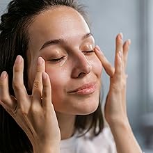 Woman applying Age-Defying Eye Cream