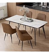 Modern dining table with white marble-look top and black metal legs, paired with two tan upholstered dining chairs featuring vertical channel tufting and metal legs.