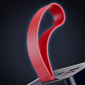 Séquence rapprochée montrant un matériau texturé rouge ou un ruban adhésif découpé ou manipulé sur un fond noir.