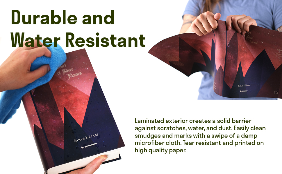 Hand wiping water drops from jacket hands trying to tear jackets from Juniper Books