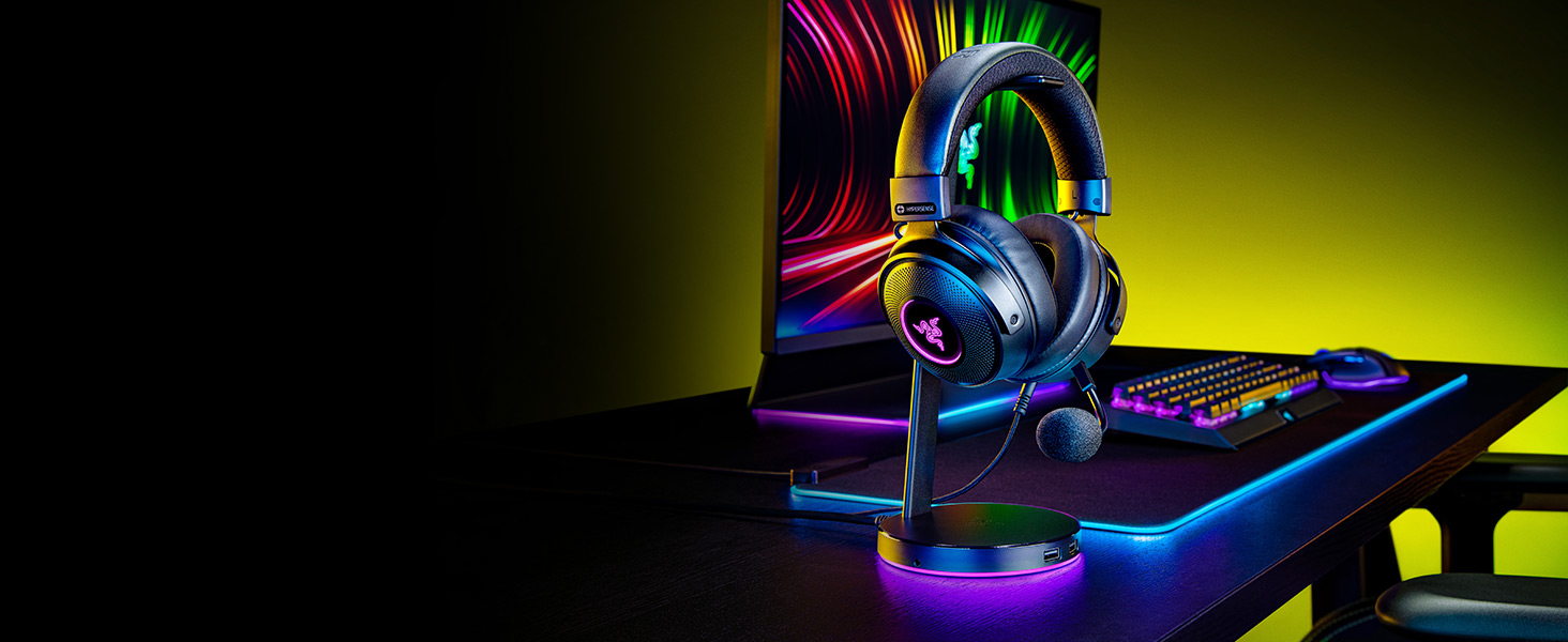 Gaming setup with illuminated blue LED lighting, showing gaming equipment against dark background.