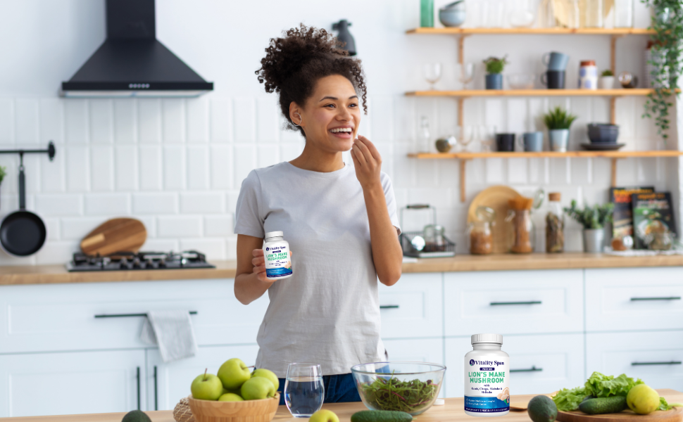 woman takes mushroom supplement