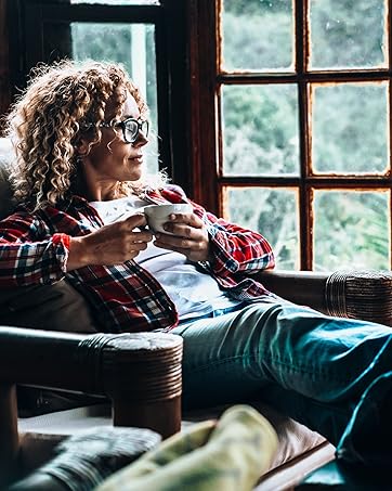 A woman enjoting a cup of Mush love coffee