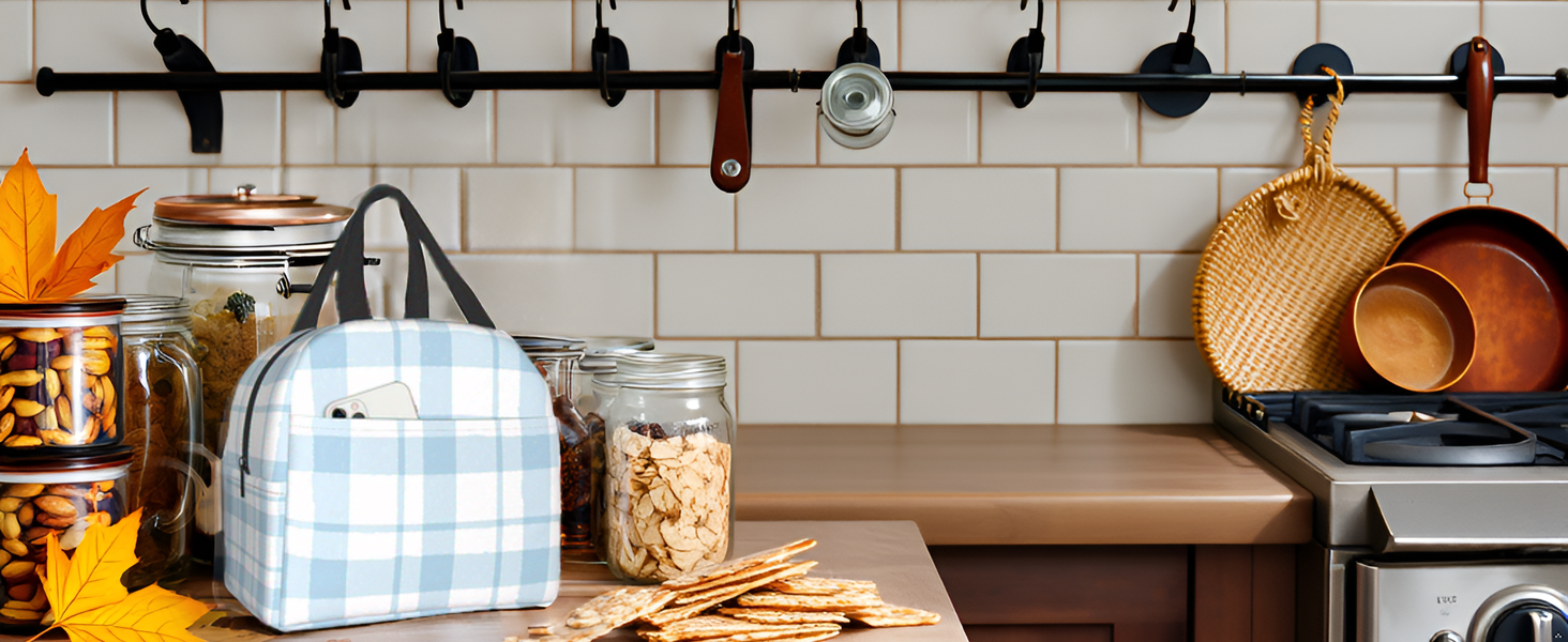 A vibrant picnic scene with a checkered blanket spread out on lush green grass, surrounded by colorf