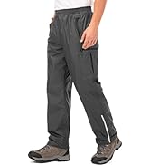 Dark gray athletic pants with elastic waistband, side zip pockets, and reflective stripe detail on lower legs. Shown with hiking boots.