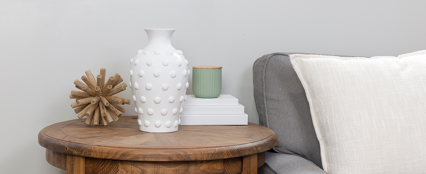 Lifestyle image of the vase styled empty in a minimalist room, e.g., side table or fireplace mantel.