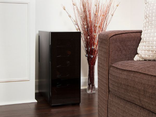 Black 12-bottle mirrored glass wine cooler, closed, in an elegant living room