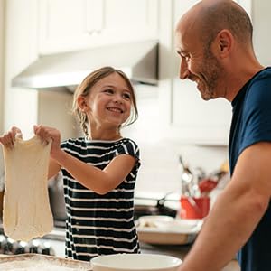 Dan and his daughter making pizza