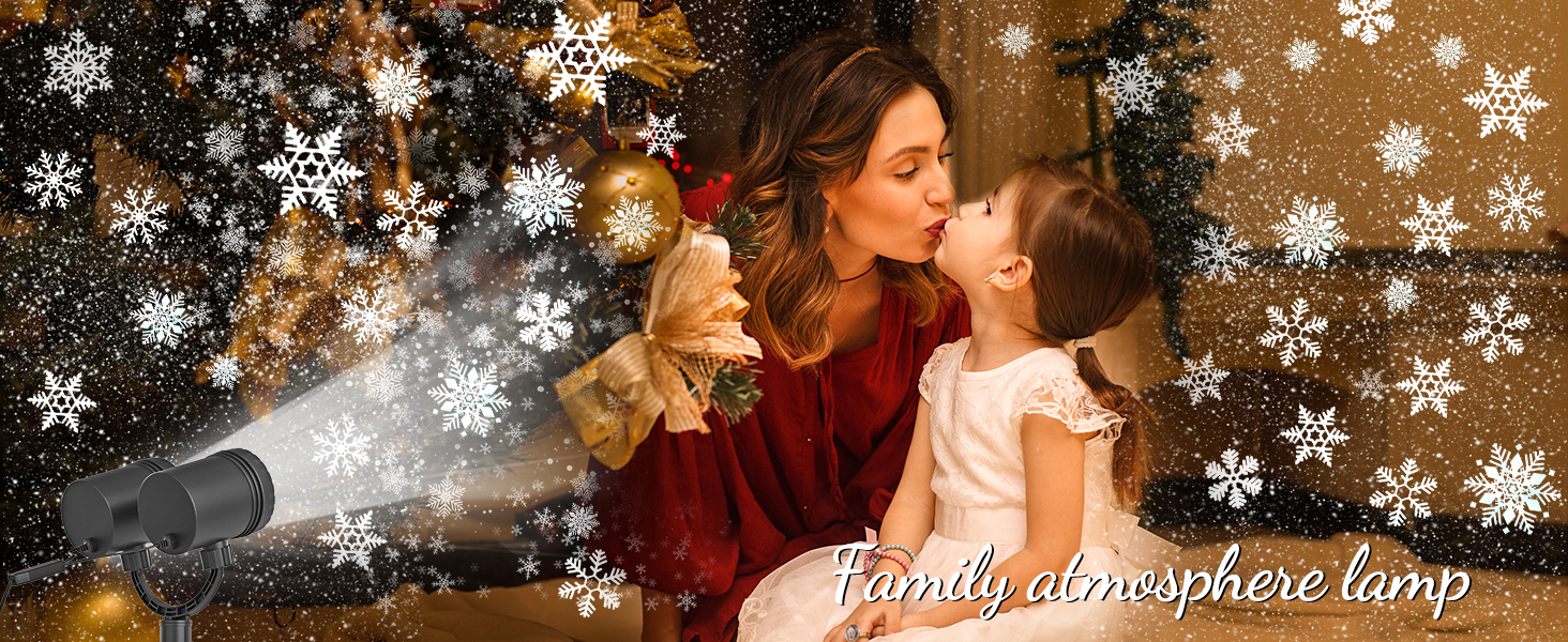 Family atmosphere lamp projecting snowflake patterns. Image shows a woman and child in a warm, festive setting with projected snowflakes.