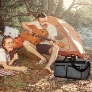 Person playing Guitar while the travel Duffel has accommodated all his camping and travel needs