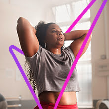 Women stretching with large tick 