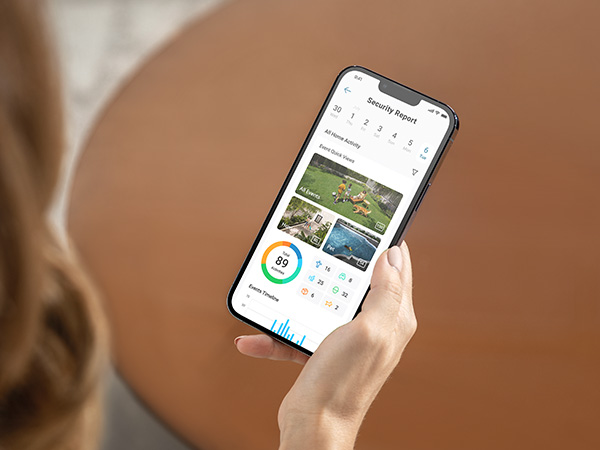 a woman holding a smartphone with a calendar app on the screen