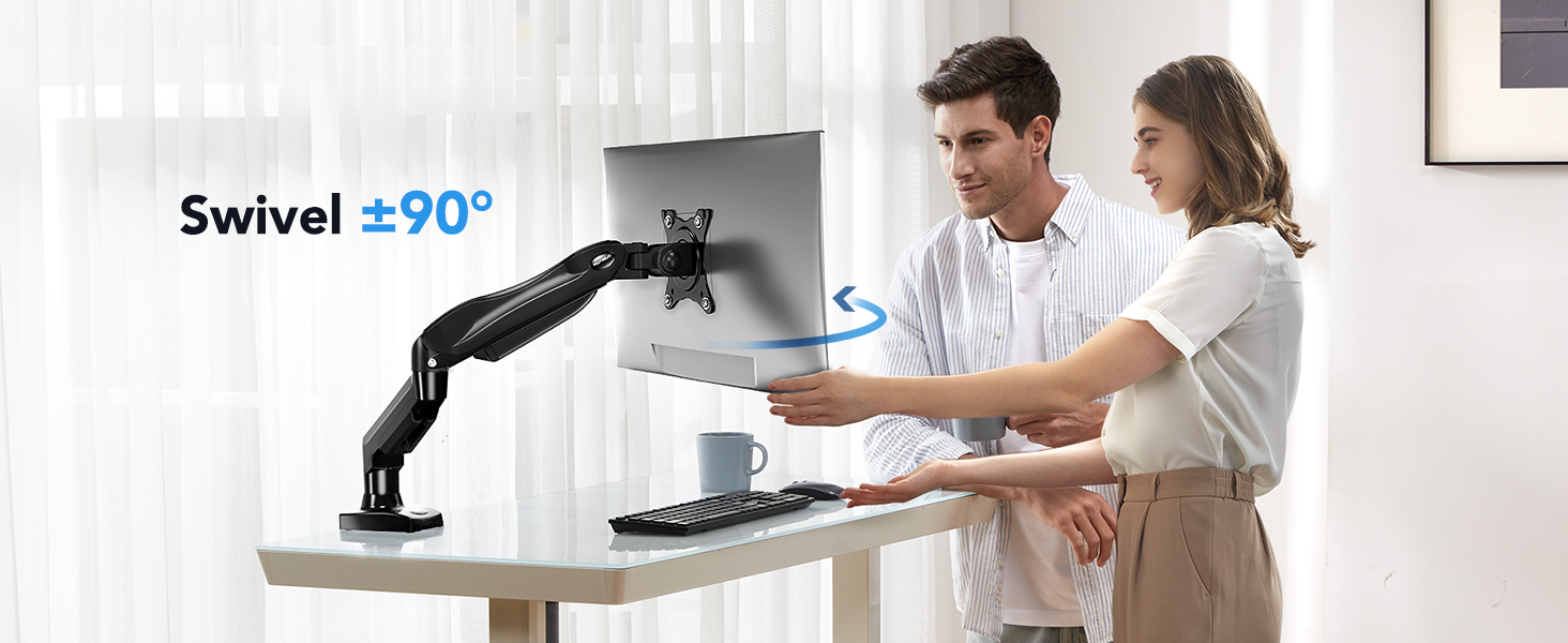 a man and woman are holding a computer with a laptop on it.