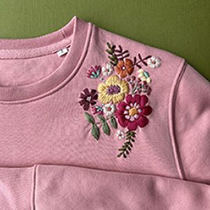 flower embroidery on a pink shirt