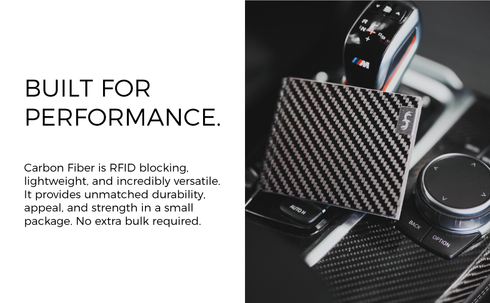 A Common Fibers LMX wallet with Grey Suede Leather leaning on a gear shift knob inside a BMW