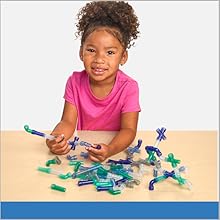 Child shown playing with Excellerations Calming Pipe Tubes - 200 Pieces