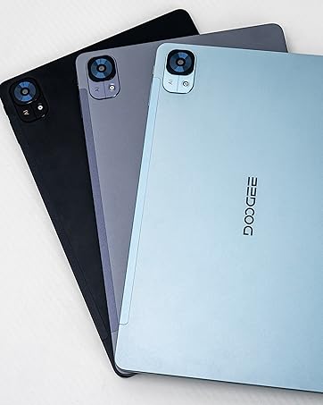 Four tablet devices arranged in overlapping display, showing different metallic finishes including silver, gray, and black.