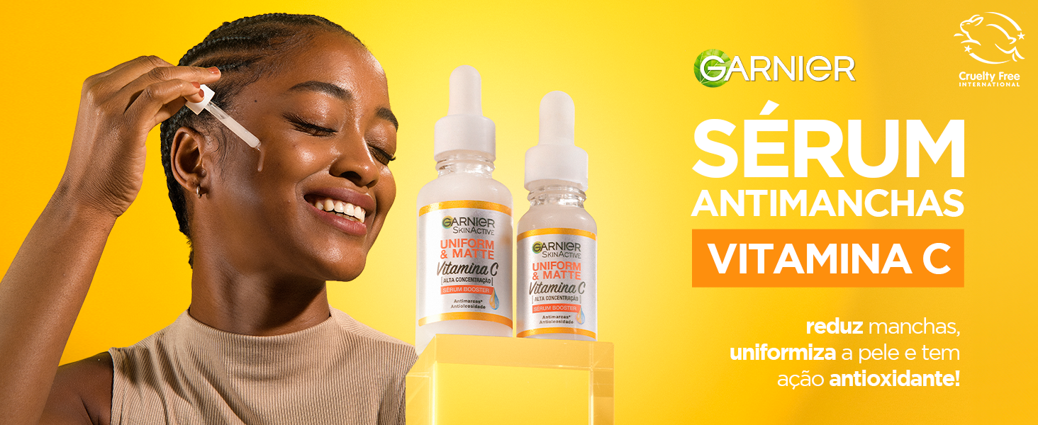 Fundo amarelo com o Sérum AntiMarcas Garnier e mulher aplicando o produto em destaque