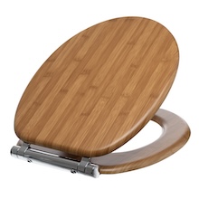 Oval-shaped wooden toilet seat with visible grain patterns. Features metal hinges for attachment. Lid is slightly raised, showing the underside of the seat.