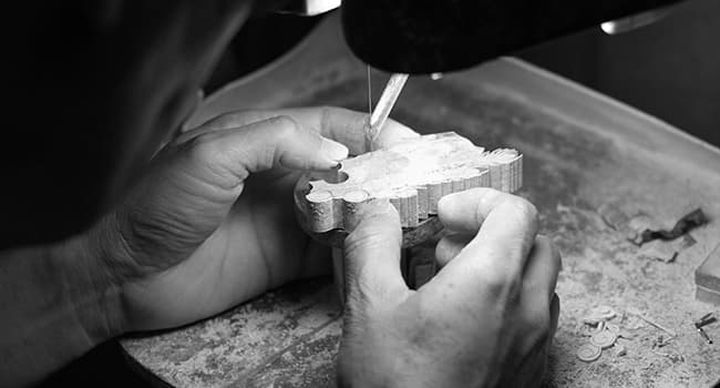 artisan cutting mother-of-pearl