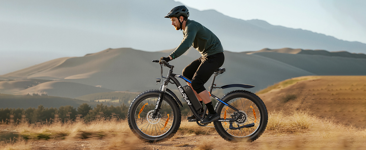 Sequence of action shots showing cyclist riding electric mountain bike through rugged desert terrain with mountains in background.