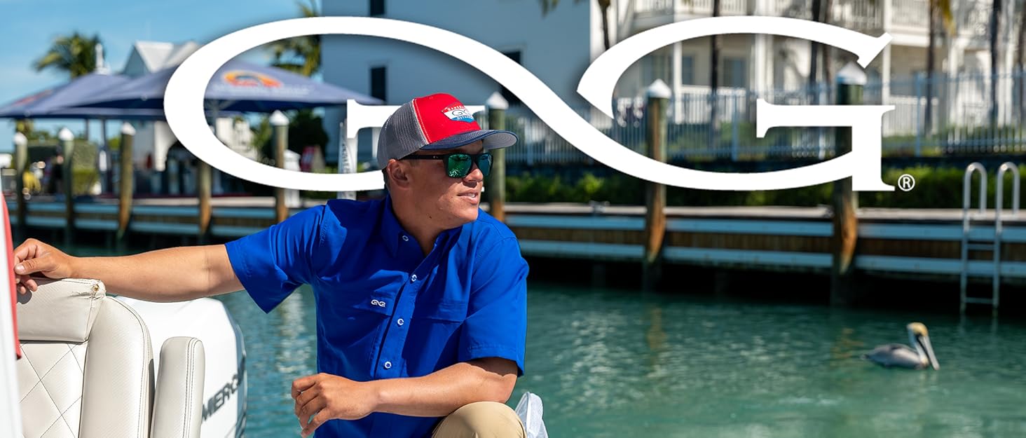 man standing on boat preparing for fishing wearing GameGuard HydroBlue MicroFiber Shirt