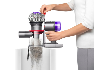 Dyson Car+Boat handheld vacuum emptying the bin.