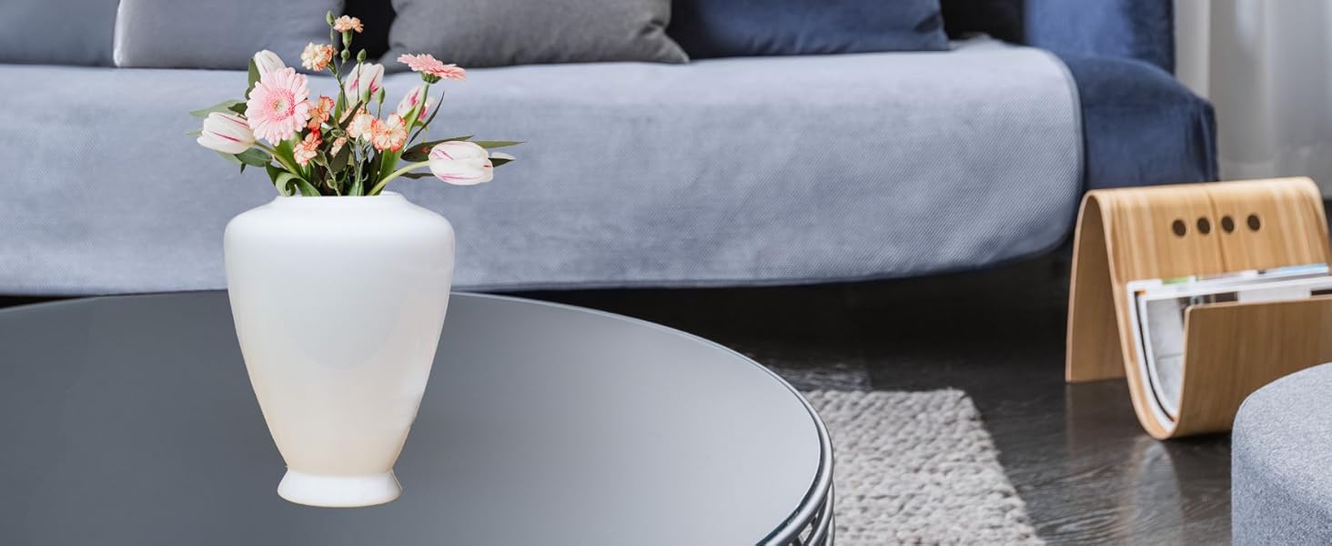 White Ceramic Ginger Jar on coffee table in front of couch